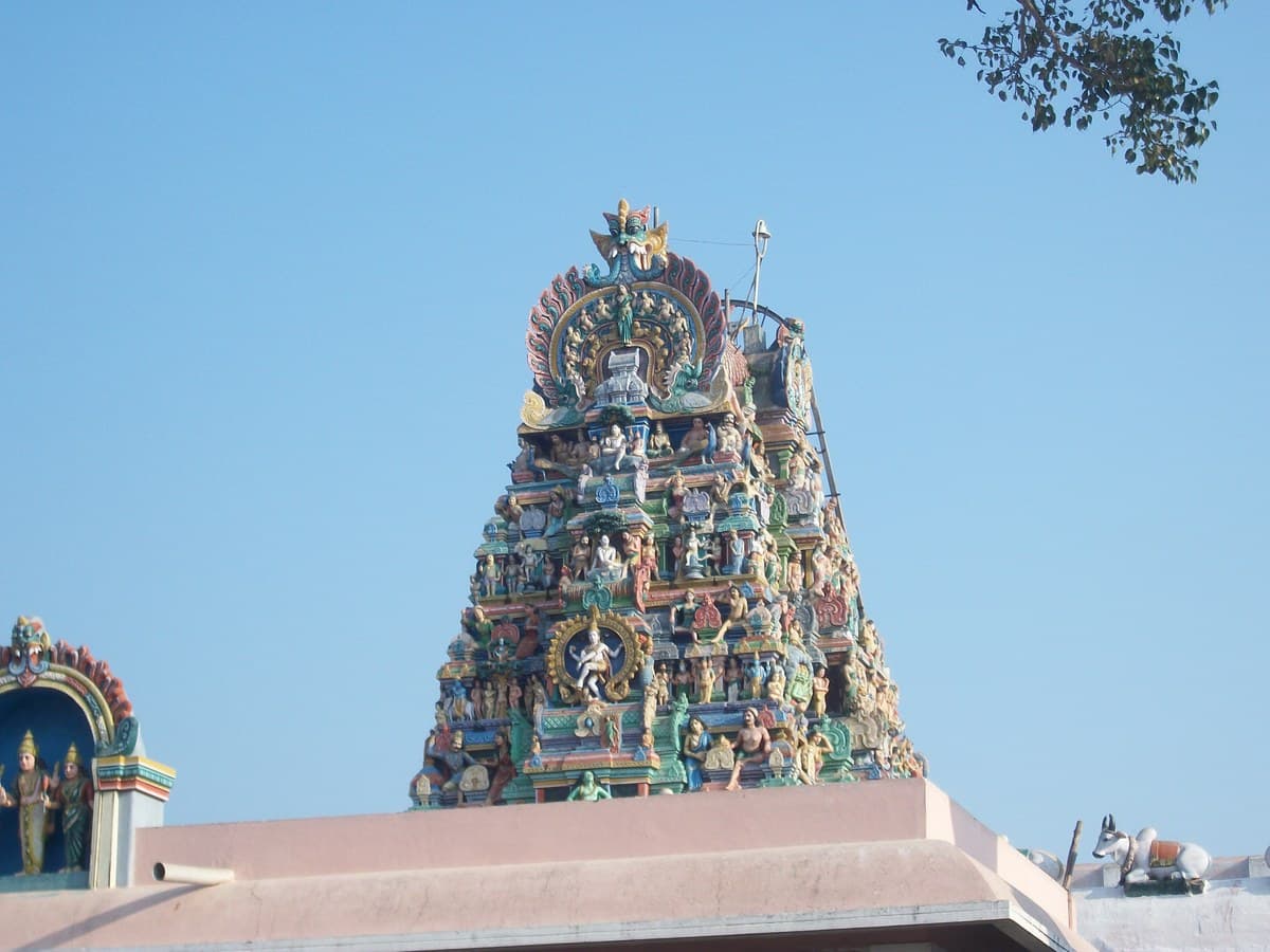 Arupadai Veedu Murugan Temple atop hill at sunset